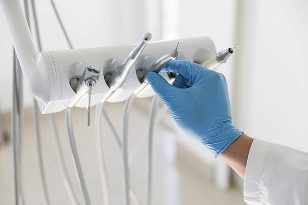 Professional Tooth Extraction technician working in North Massapequa, NY